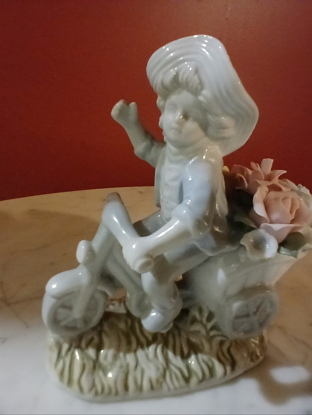 White Porcelain Boy on Tricycle Decorative Figurine with Pink Floral Accent